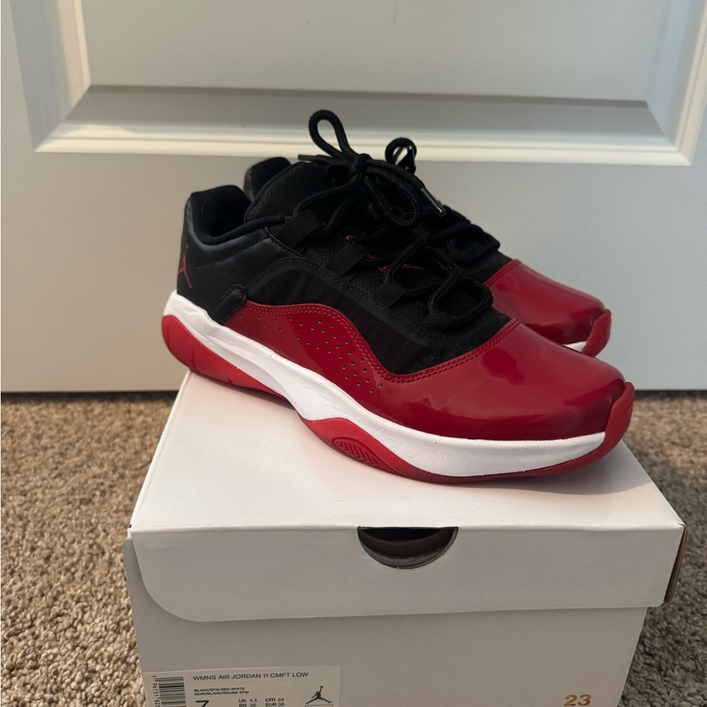 Woman’s Air Jordan red and black